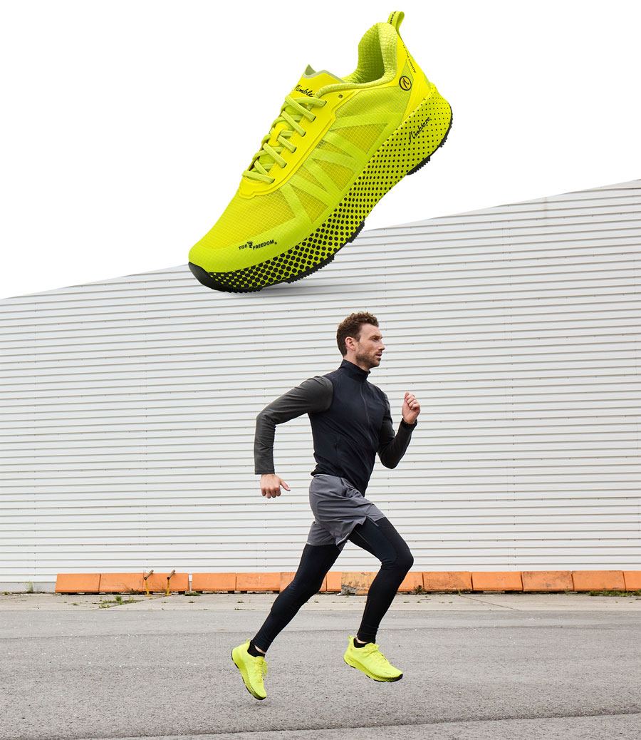 Closeup des Joe Nimble Addict Pro-R Laufschuh in Gelb und mit Läufer beim Lauftraining